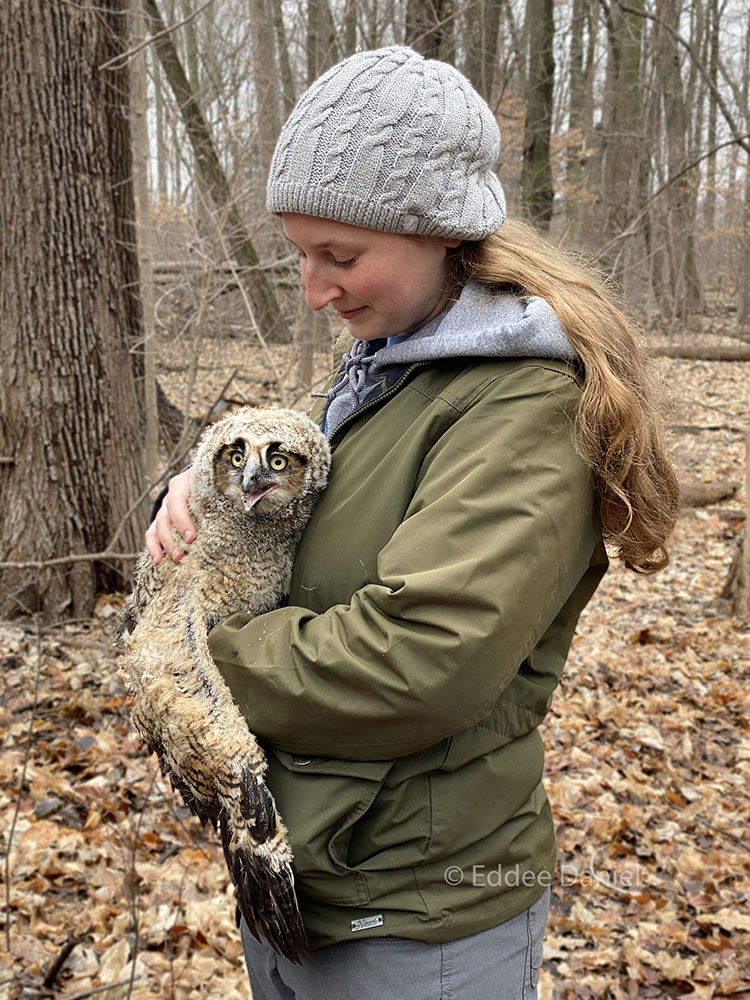 Photographer Lizzie Melk with an owlet.