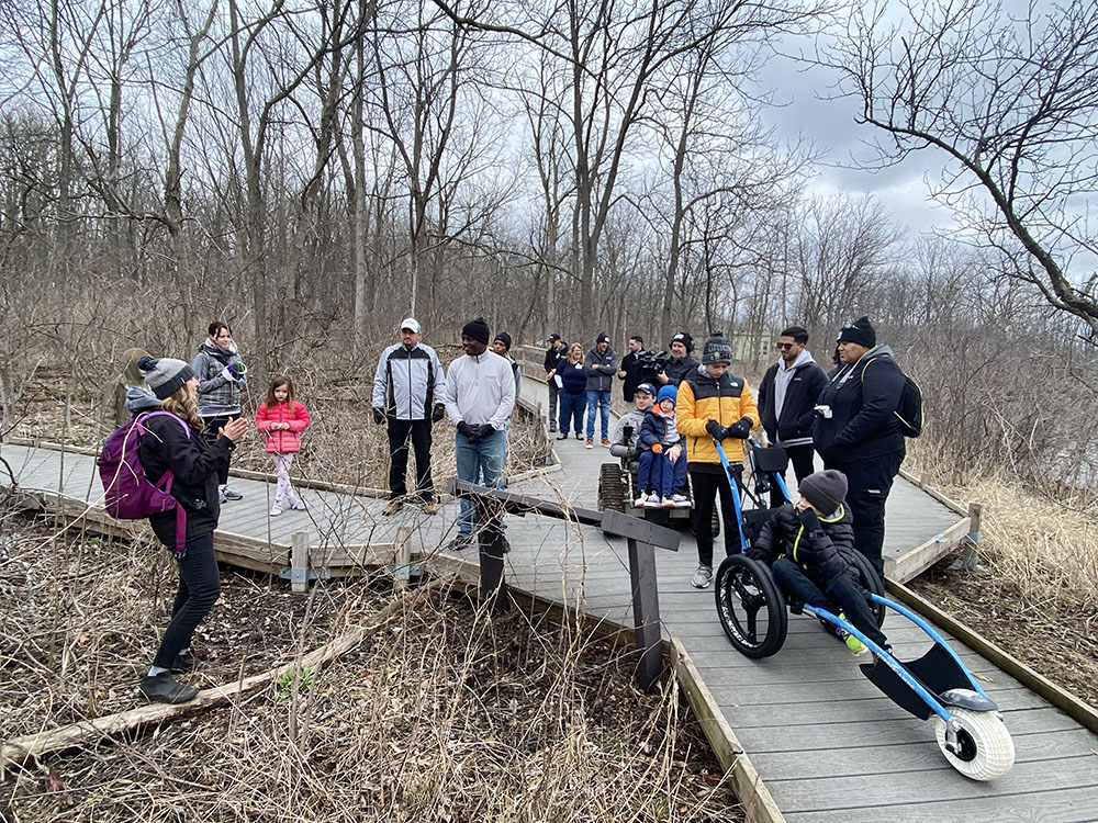 County Executive David Crowley (center, in gray sweatshirt) joined a tour guided by Wehr Nature Center director Carly Hintz (far left).