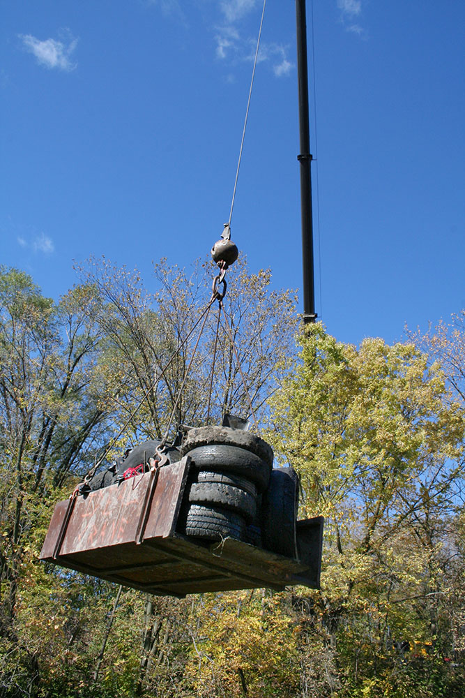 2006 was one of the early years when there was so much heavy trash that a dumpster and crane were needed to remove it all from the Kinnickinnic River near Baran Park.