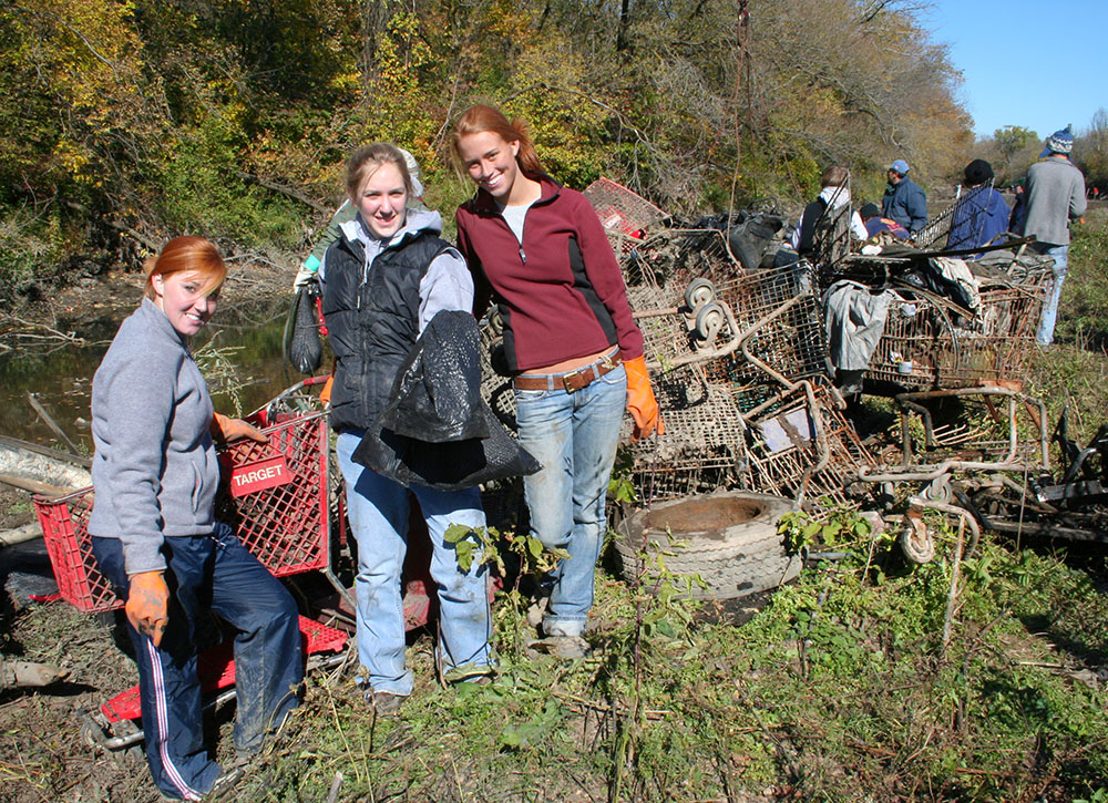 The "shopping cart brigade" with a collection of shopping carts removed from the Kinnickinnic River in 2006.