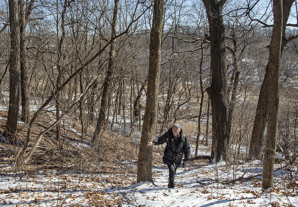 Chuck Stebelton walking in the Milwaukee River Greenway.