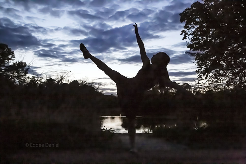 dancer silhouetted against the evening sky