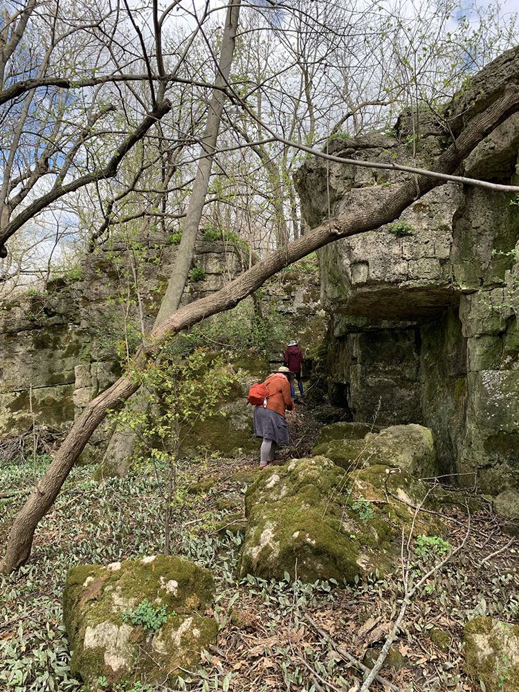 The humans are dwarfed by the great limestone blocks.