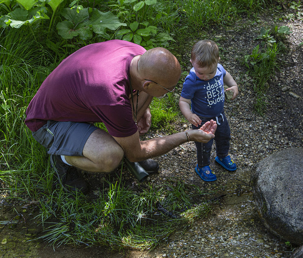 Sampling the crystal clear spring water.