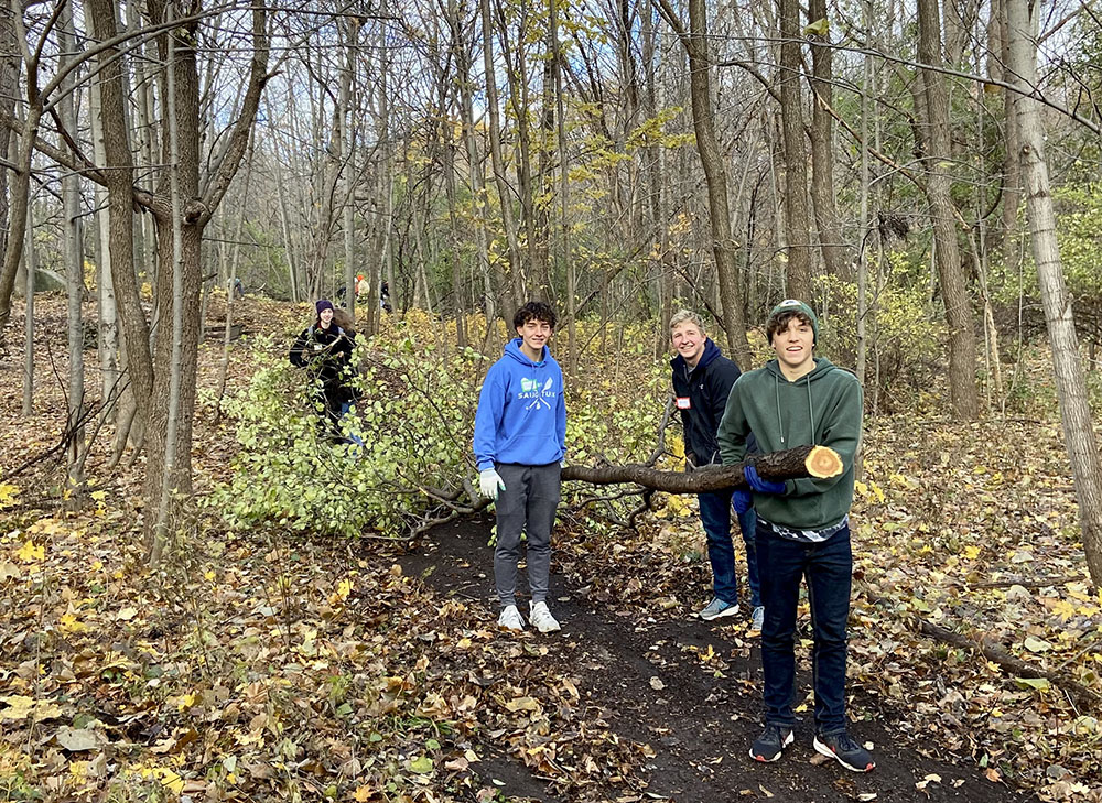 Tosa East Youth removing invasive buckthorn from the sunken gardens.