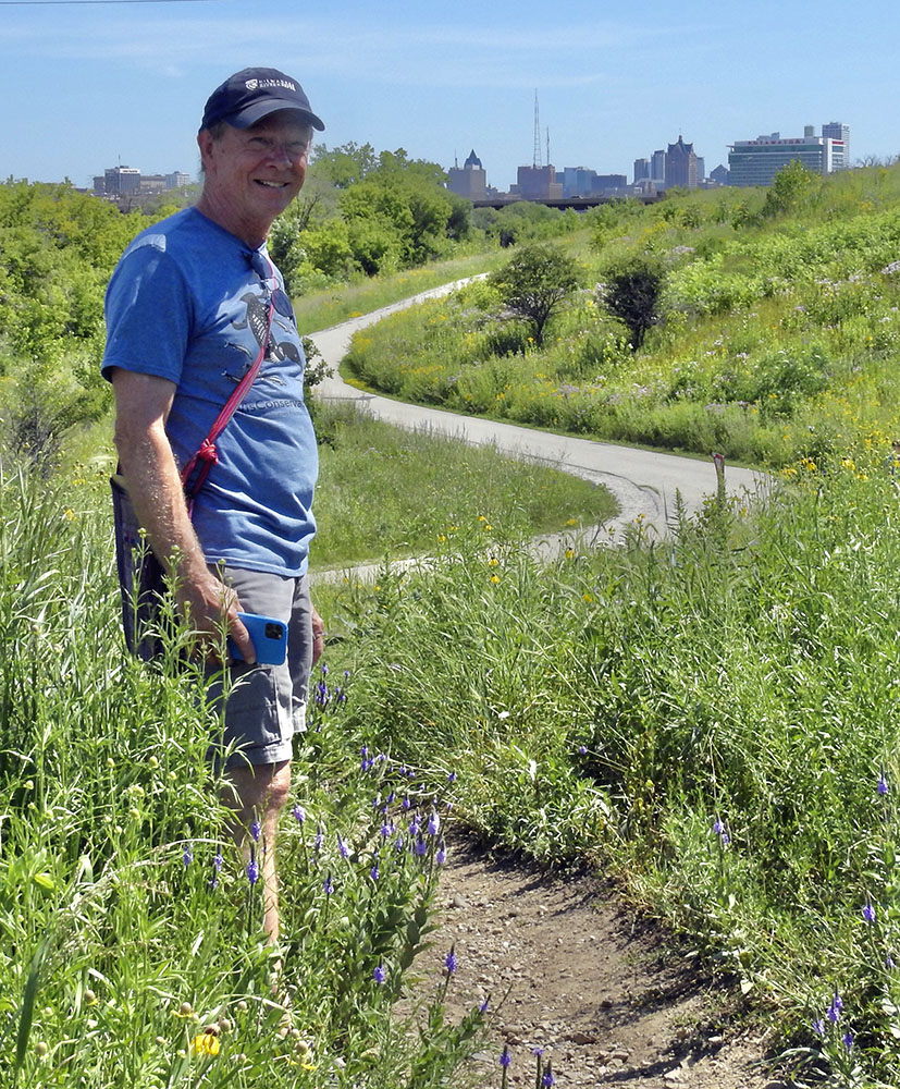 Tour guide Eddee Daniel on hilltop overlooking the Hank Aaron State Trail.