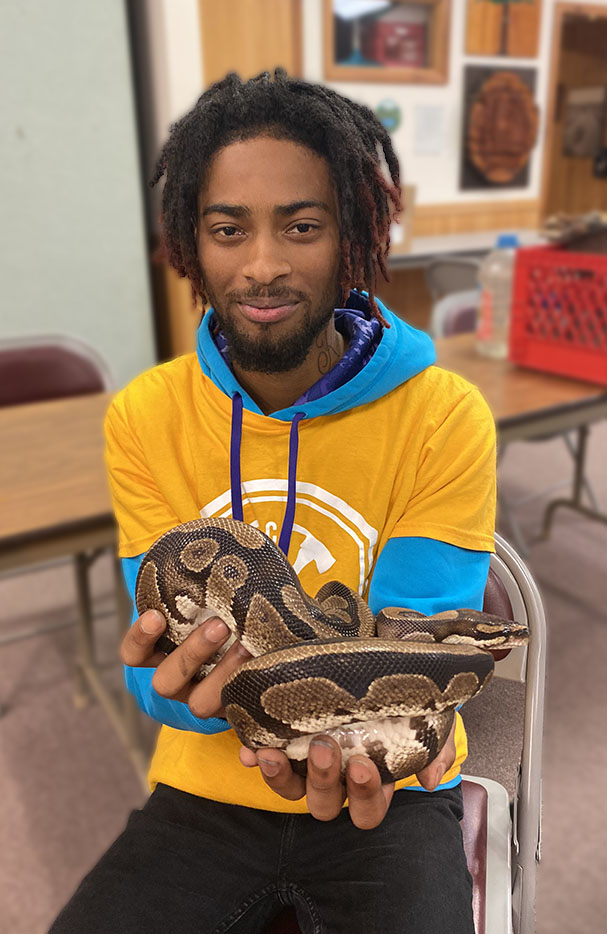 Richard Bowers with a snake named Google.