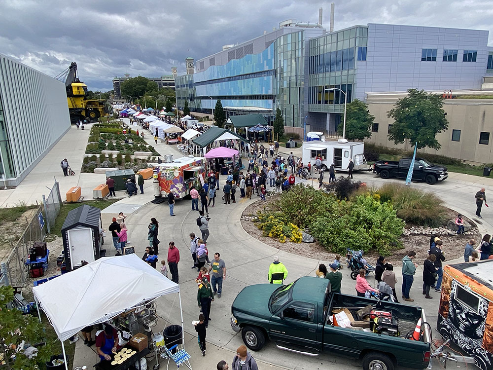 Harbor Fest bustles along the east end of Greenfield Avenue between Komatsu (left) and the UWM School of Freshwater Sciences (right).