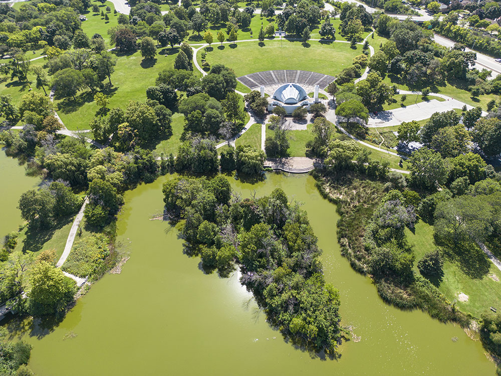 Aerial view of a portion of Washington Park shows the Bandshell and Promenade overlooking the lagoon.