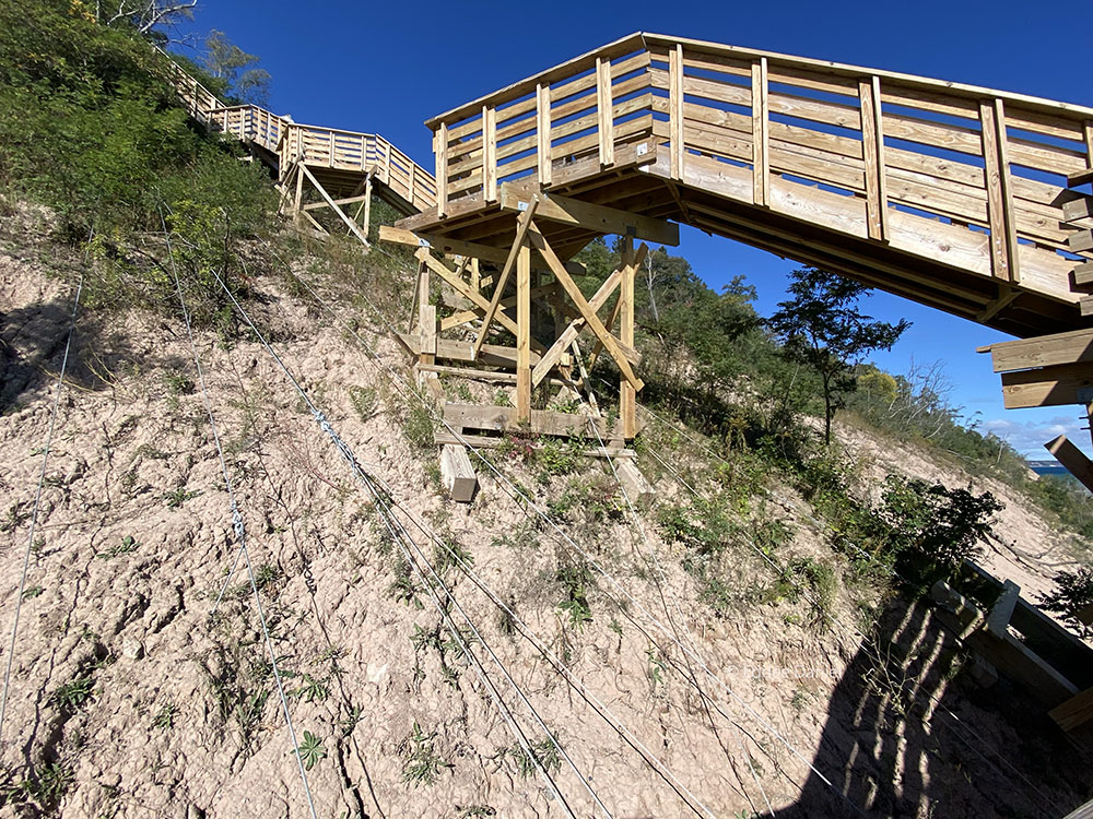 Cables supporting "floating" stairway.