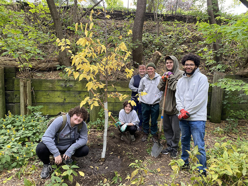 Student volunteers pose near their freshly planted Hackberry tree on the Beerline trail. CP