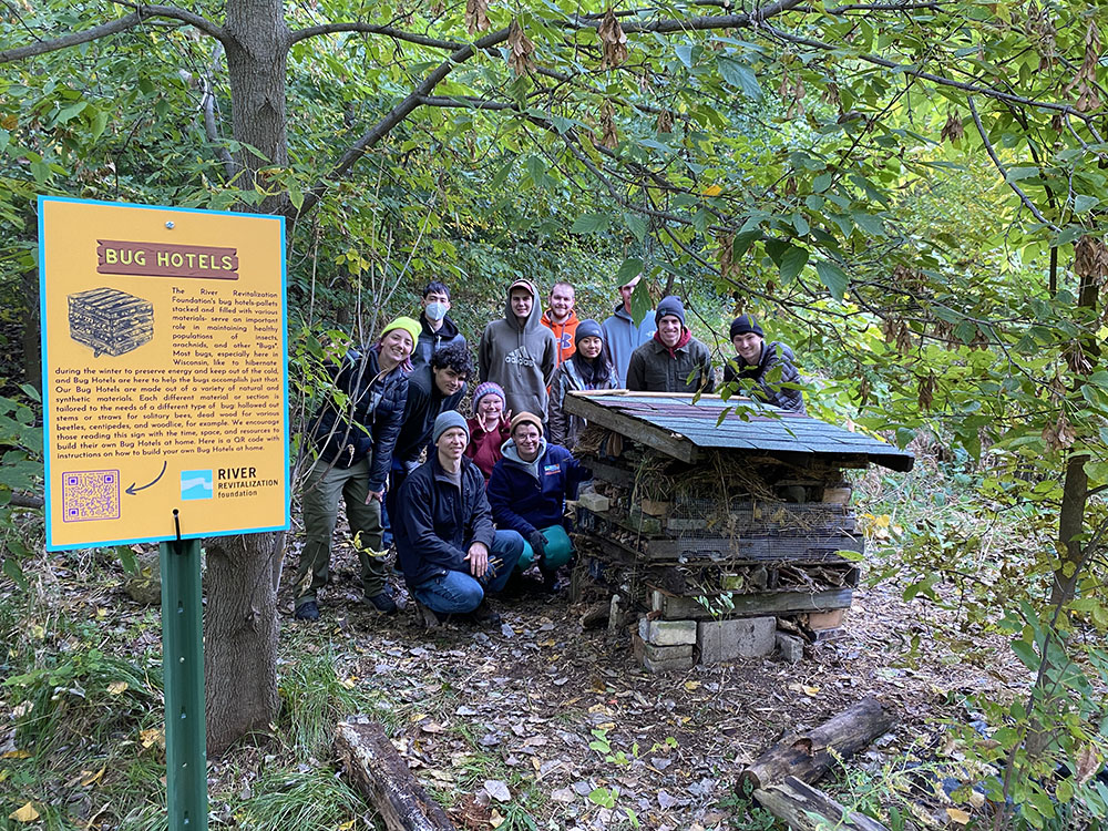 Students pose with the new bug hotel. The informative sign also provides a QR code that links to a construction guide. CP