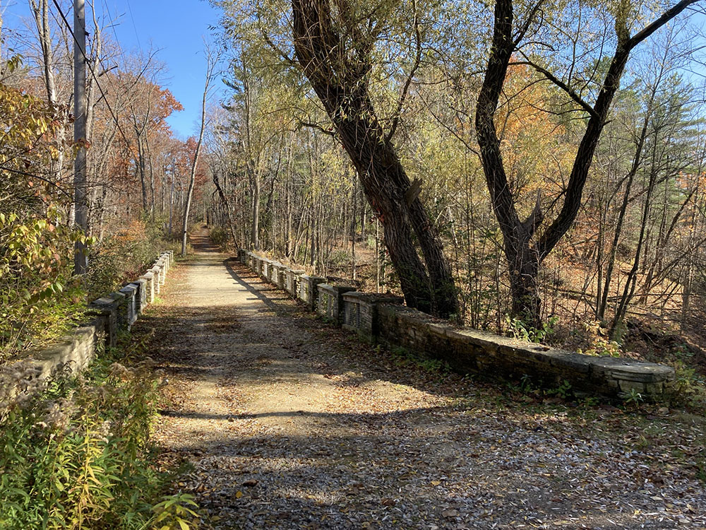 A bridge crosses a deep ravine onto the main part of the preserve.