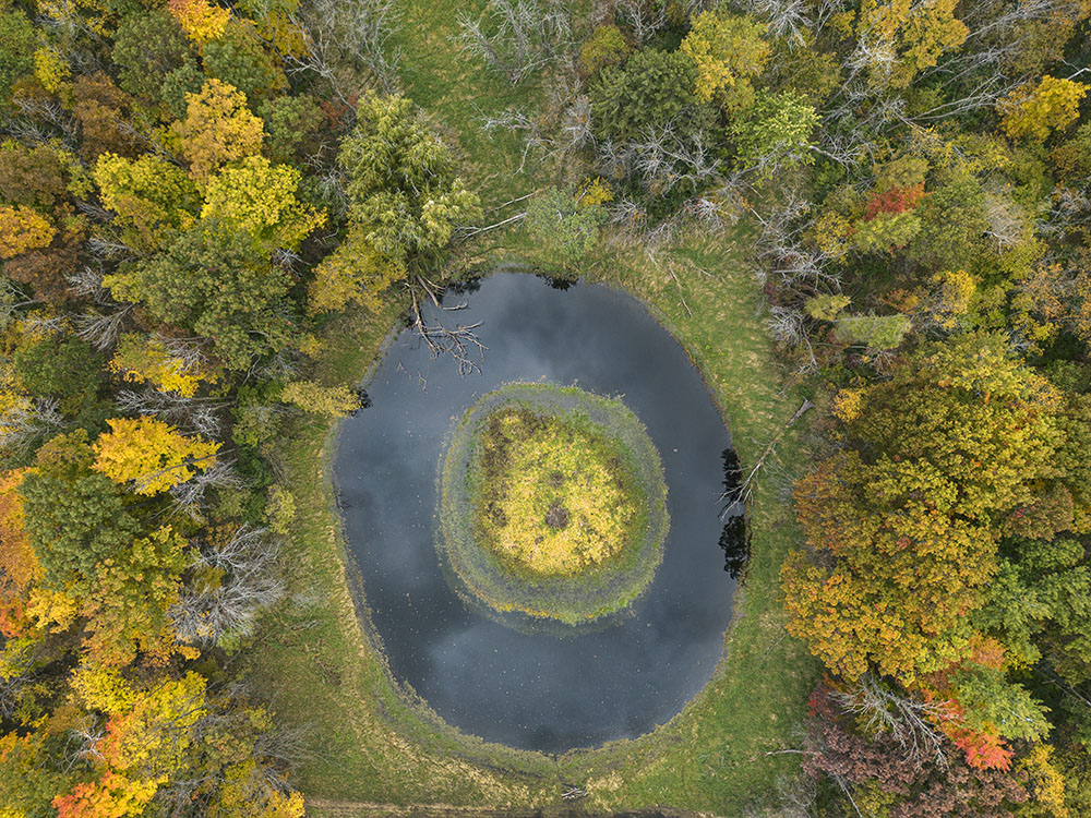 Aerial view of a donut-shaped pond.