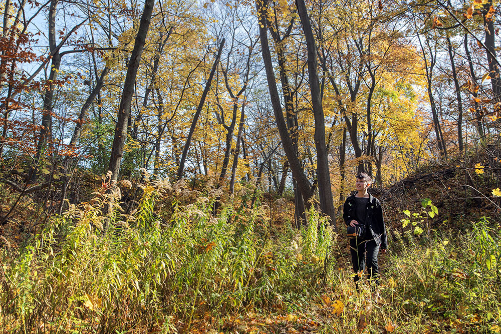 Julia Scheckel walking in the north ravine at Lake Park.