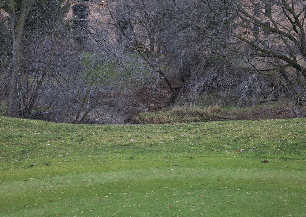 Underwood Creek sandwiched between the golf course and apartment buildings