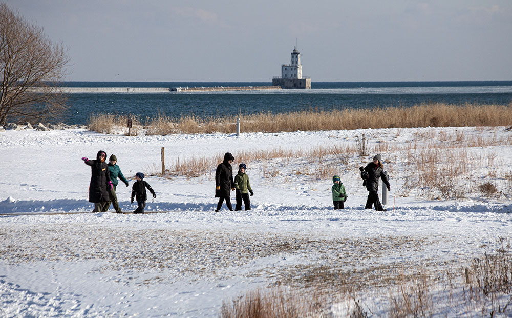 Groundhog Day hikers of all ages in the park.