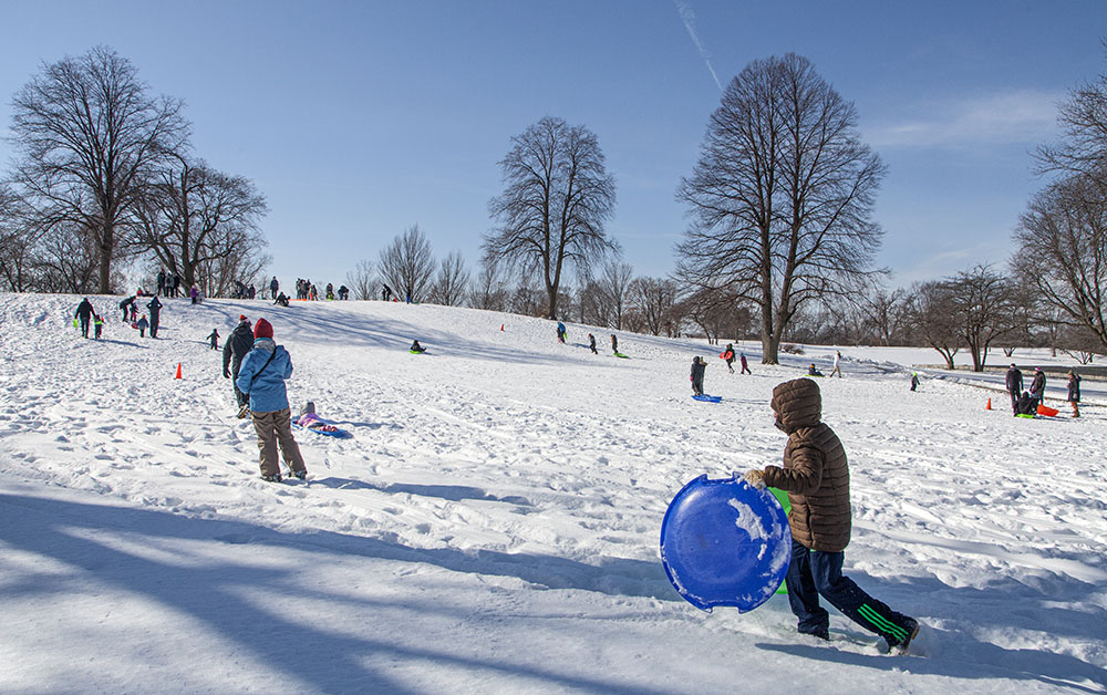 The sledding hill was as crowded as I've ever seen, and as I was leaving more people were streaming into the park.