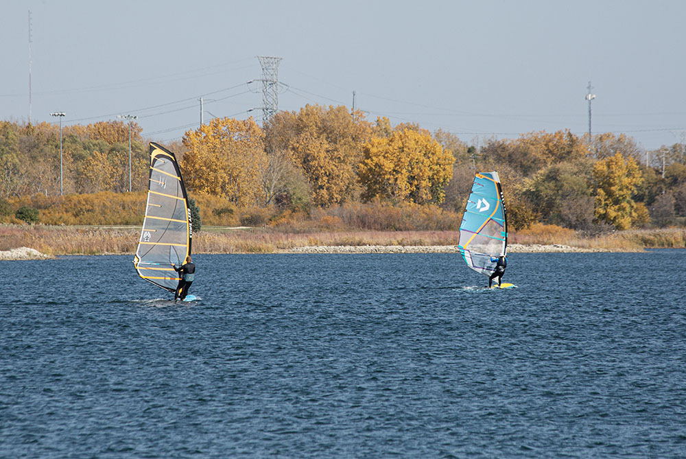 Sailboarders catch the breeze on Lake Andrea at Prairie Springs Park. 