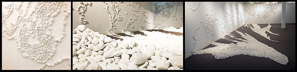 Here I Am, date, site-specific installation for Northern Arizona University Art Museum, 20,000 cast plaster rocks.