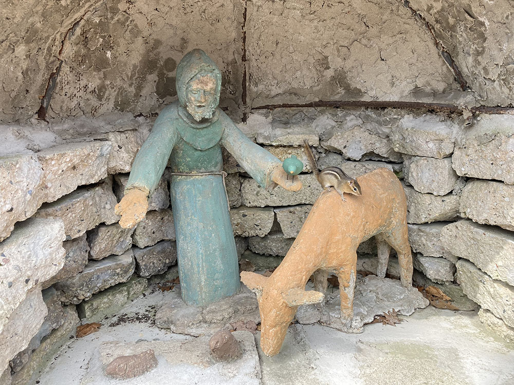 Saint Francis Grotto with a chipmunk that came by for a blessing.