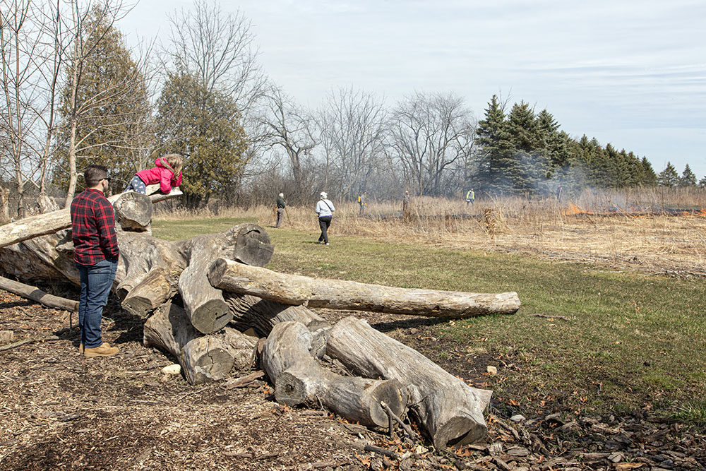 Spectators on the playground watching the progress of the burn.