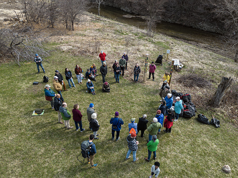 The group gathered at the trailhead next to Lincoln Creek to dedicate the new Peace Posts.