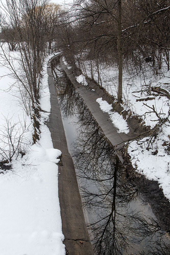 The channelized waterway along the border of Harriet Tubman Park.