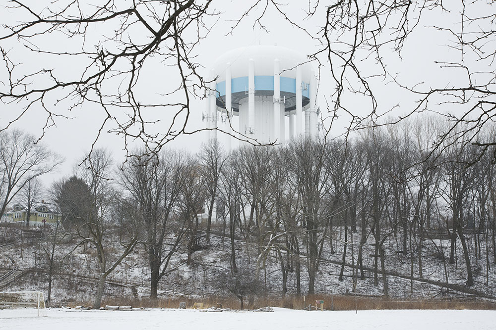 The hillside and water tower in winter.