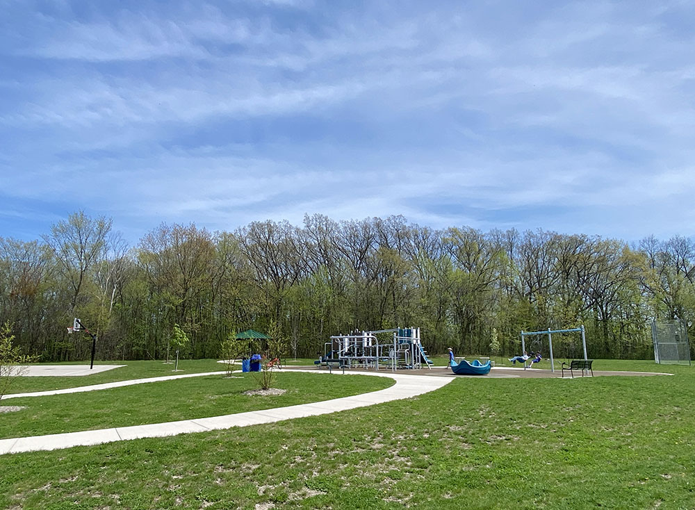 Biwer Park playground with a view of the woodland.