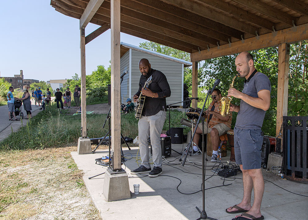 The Brandon Payton-Carillo trio plays for the crowd and anyone passing by on the Hank Aaron State Trail.