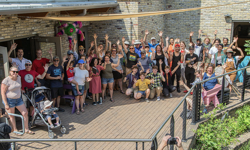 A group portrait with many of the same people who were present at the opening ten years ago.