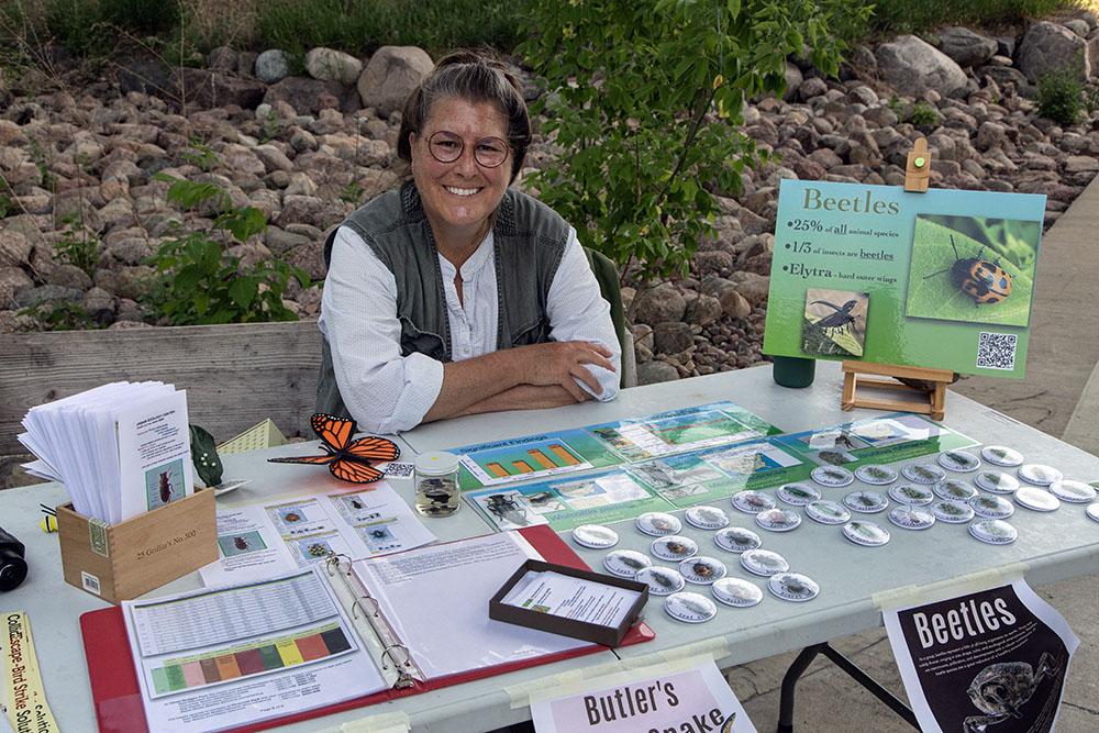 Volunteer Heidi Meier at her beetle station, one of several in various locations in Stormwater and Three Bridges Parks.