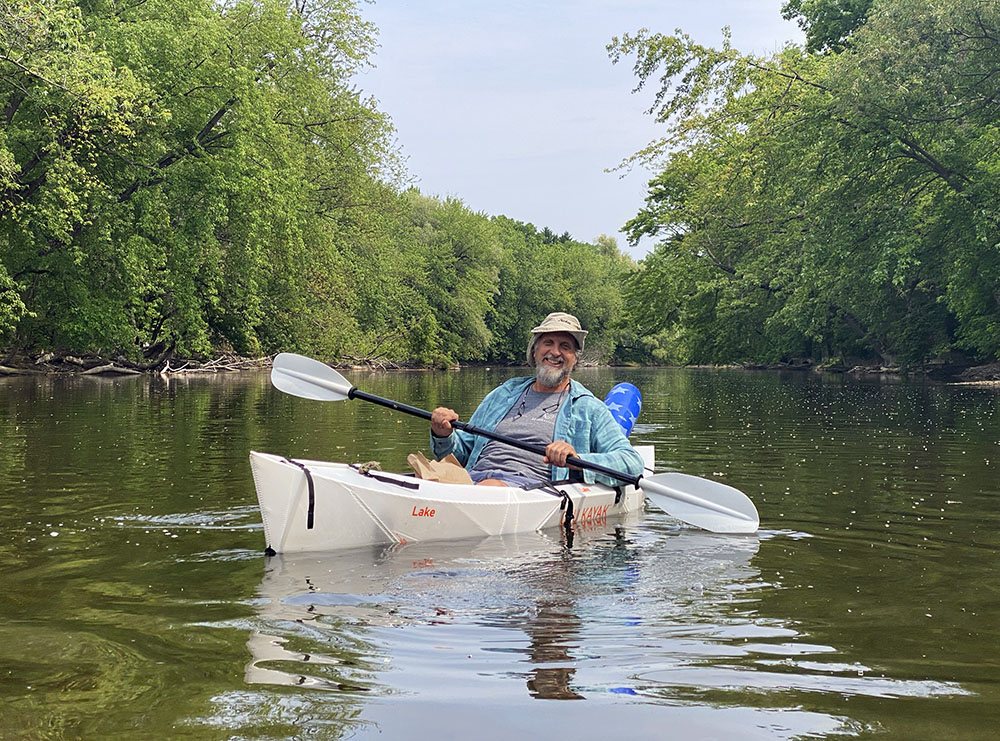 Ken Leinbach enjoying his last kayaking excursion as Executive Director of the Urban Ecology Center.