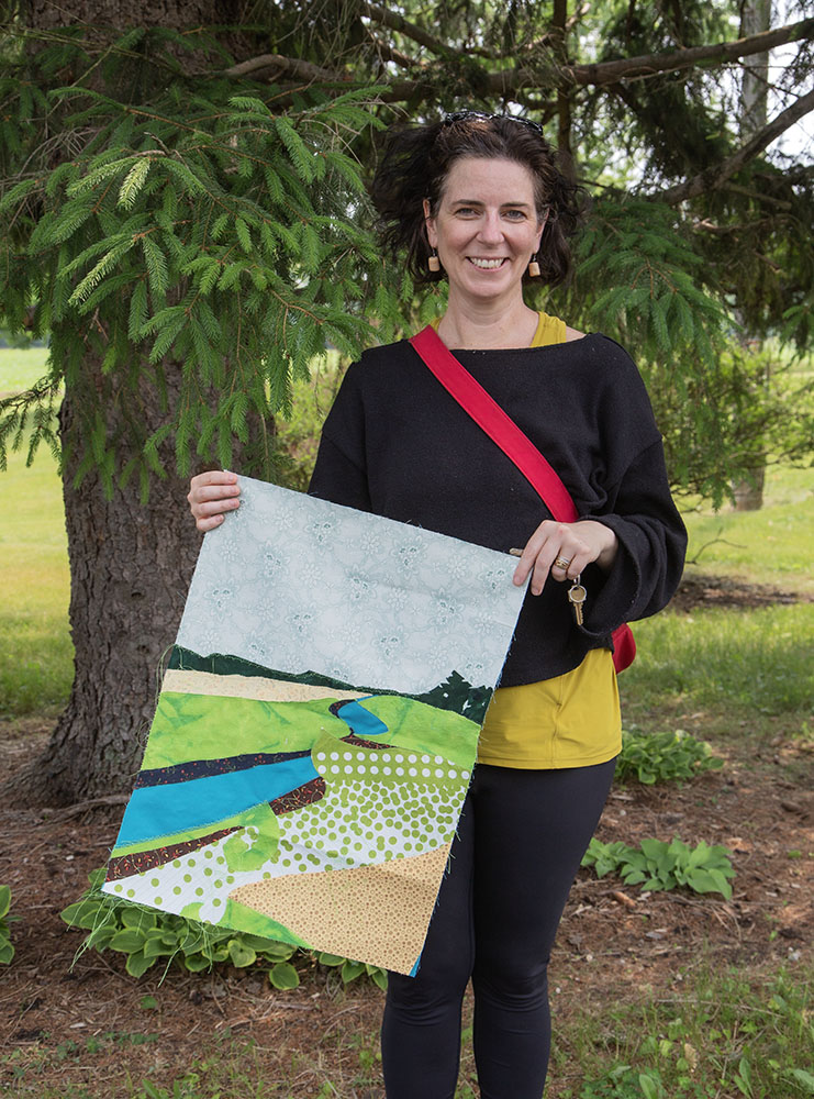 Muthupandiyan with a mock up of a planned quilt.