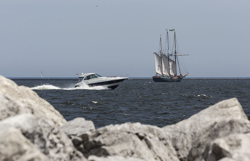 The chance juxtaposition of the two boats creates a contrast that wouldn't be present in a shot of either one by itself.