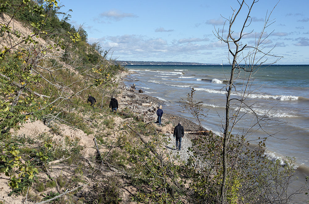 Exploring the beach after descending the stairway.