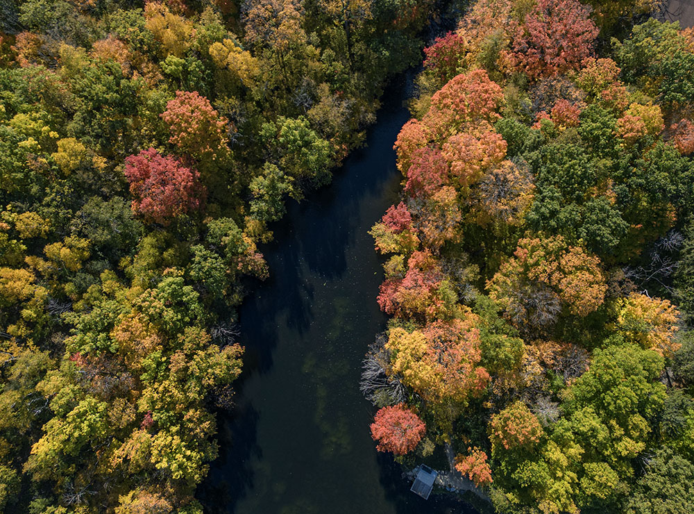 Aerial view showing Wells Lake between autumn ridges.