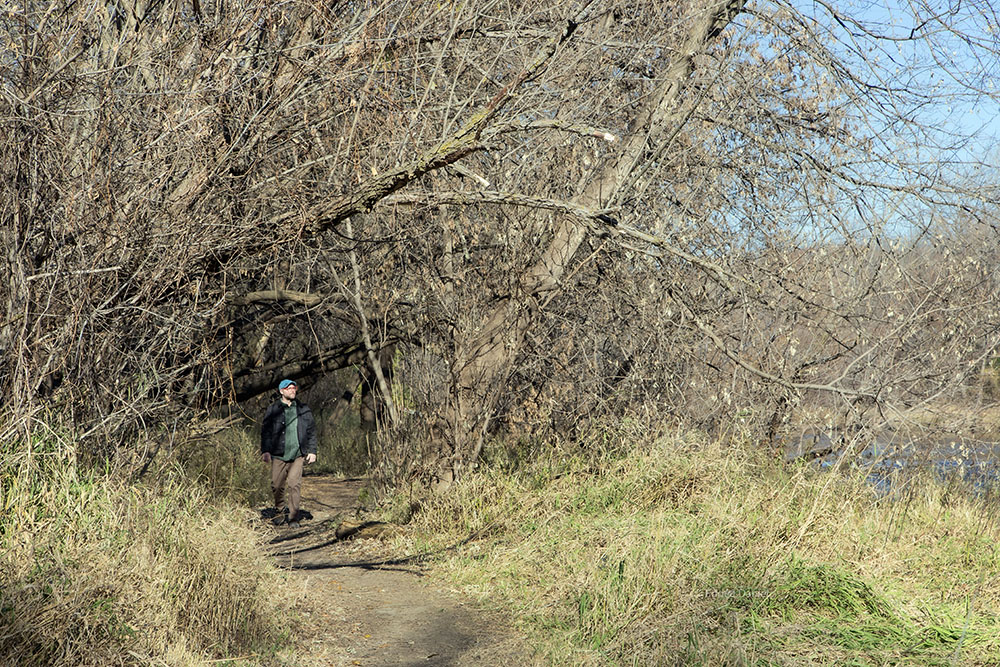 Brian Hibbard walking a riparian trail in the Milwaukee River Greenway.