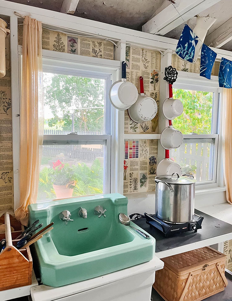 Natural dye studio in my backyard garden, seen through windows.