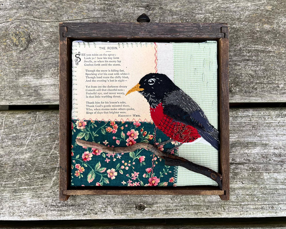 American Robin. Fabric scrap and book page poem framed in an antique drawer.