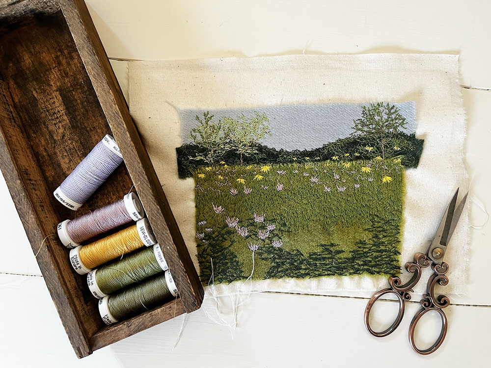 Tiny free motion embroidery stitchscape of FBMP's wildflower prairie.