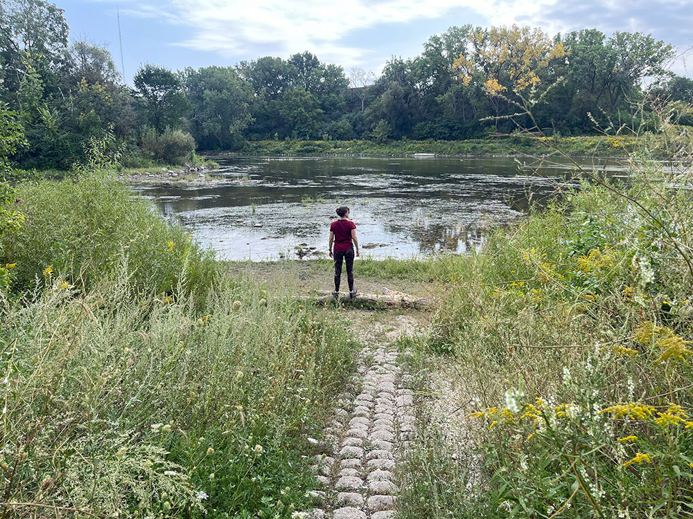 A hiker overlooks the Milwaukee River.