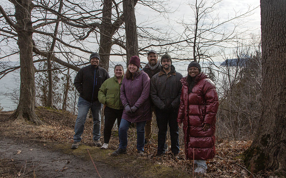 The Warnimont Park group pauses to pose against the backdrop of Lake Michigan.