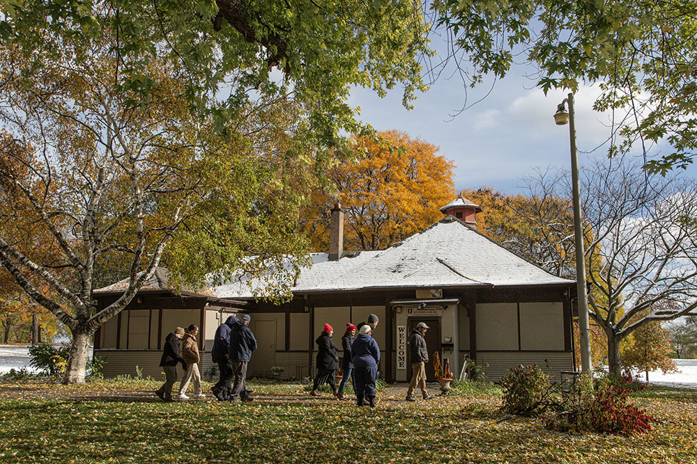 The group stops at the Del Porter Boxing Club Pavilion to learn about its history.