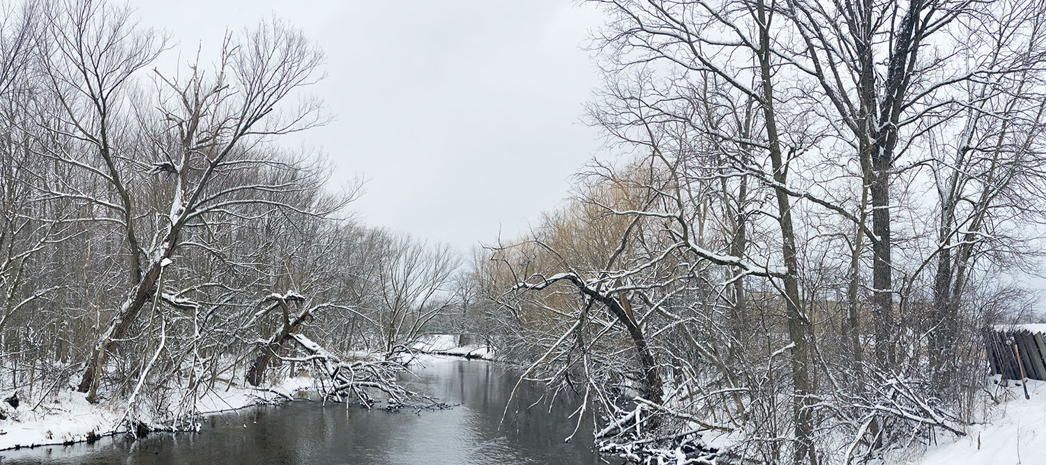 Milwaukee River in snow from Quaas Creek Park