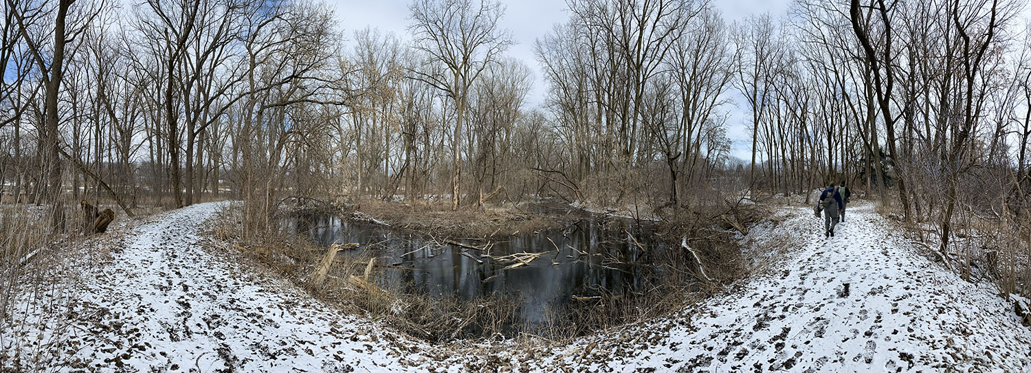 Snowy trail wraps around an oxbow