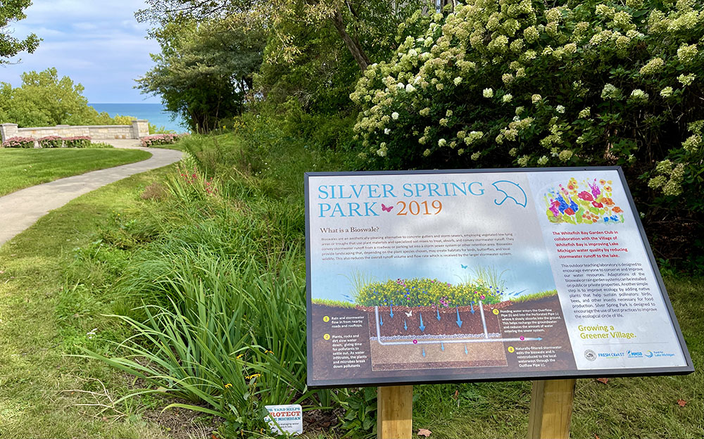 Educational sign describing the bioswale, a type of green infrastructure that captures rain water where it falls.