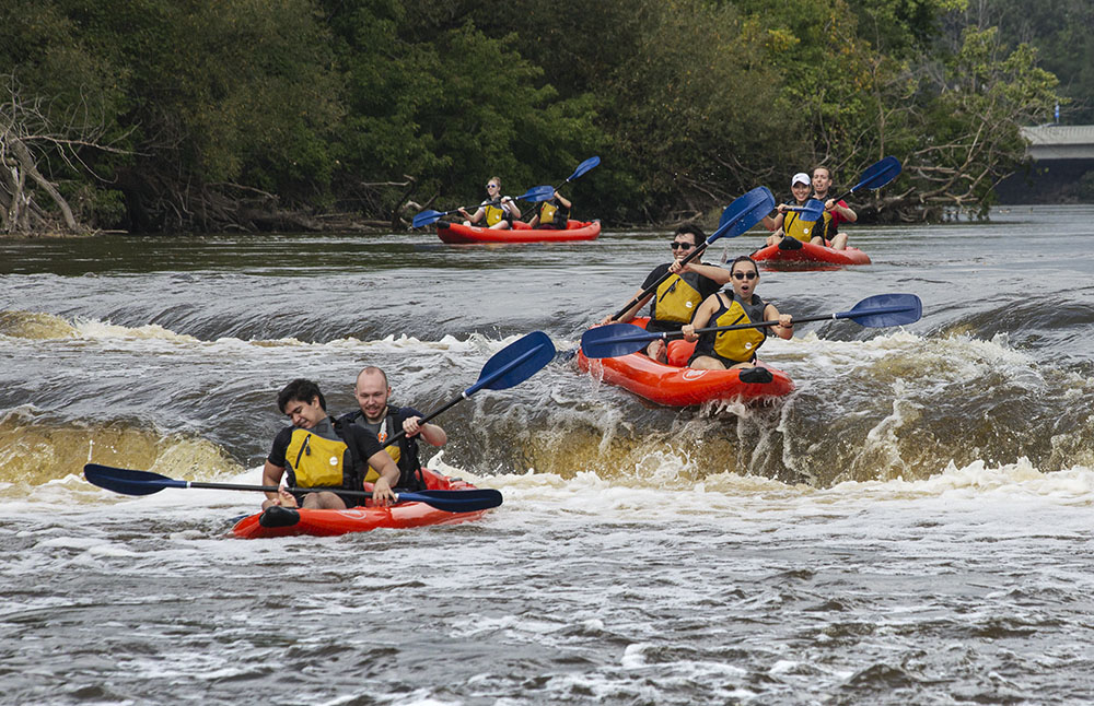 A quartet of rafters brave the plunge over Estabrook Falls.