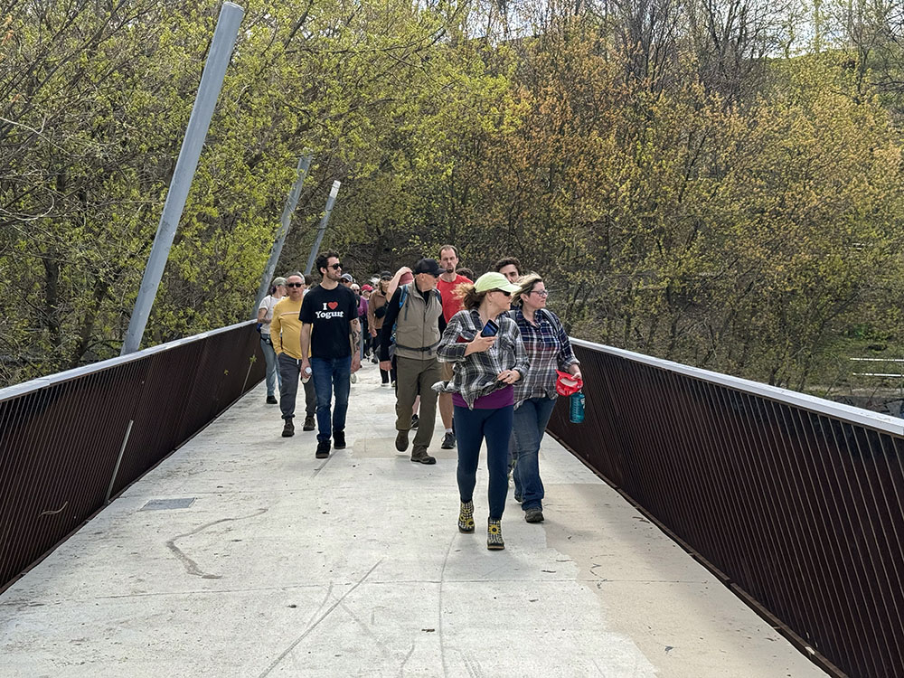 The group on the pedestrian bridge connecting Caesar's Park with Turtle Park at the former dam site.